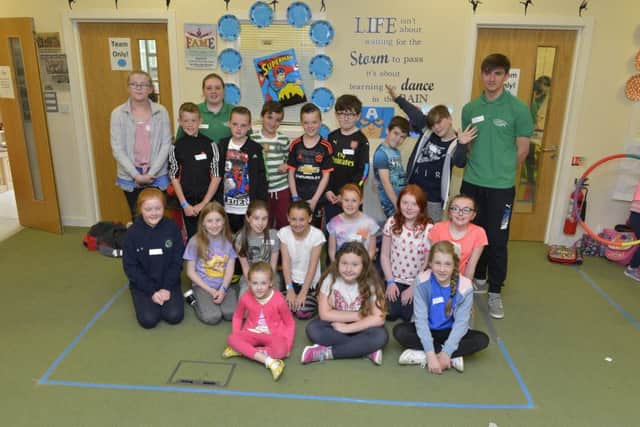 Some of the children who attended the Derry Search Youth Group Fun Festival in Iona Business Park on Tuesday last pictured with group leaders. DER2816GS014